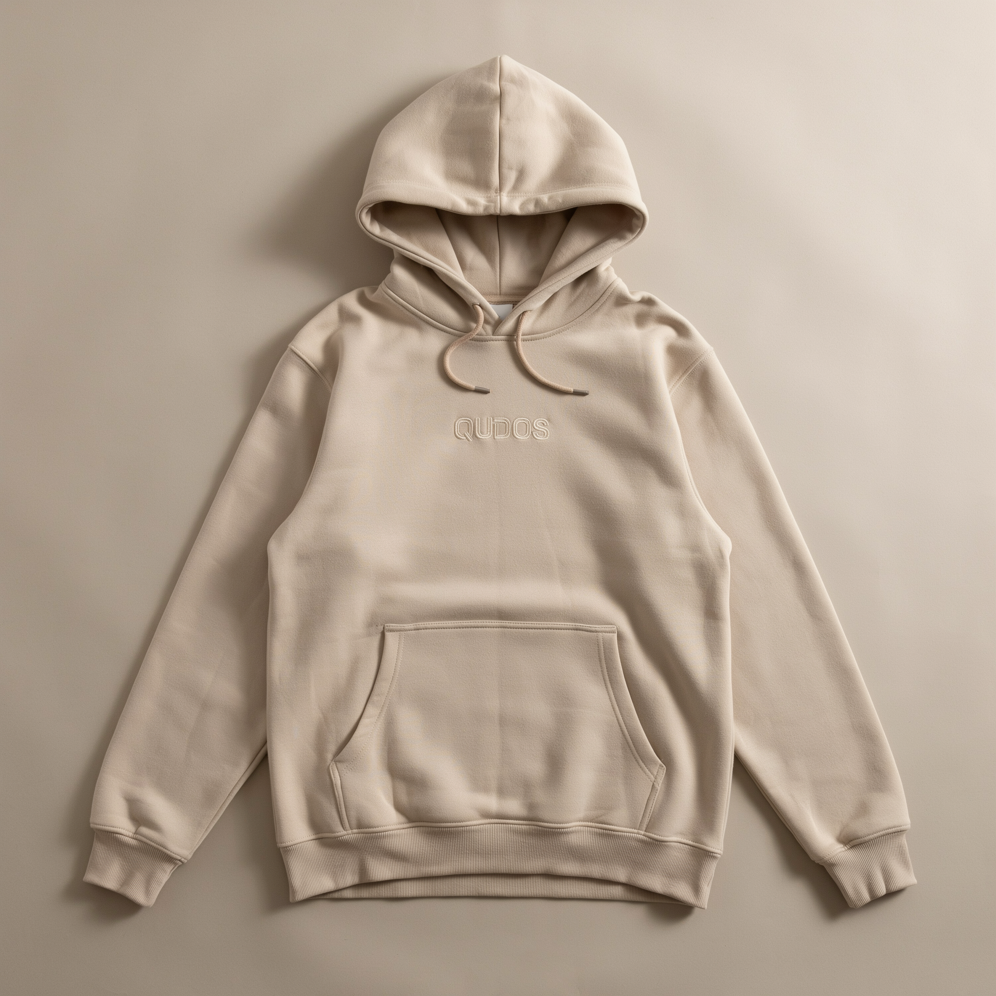 Qudos white hoodie analyzed for layering potential and contemporary streetwear silhouette