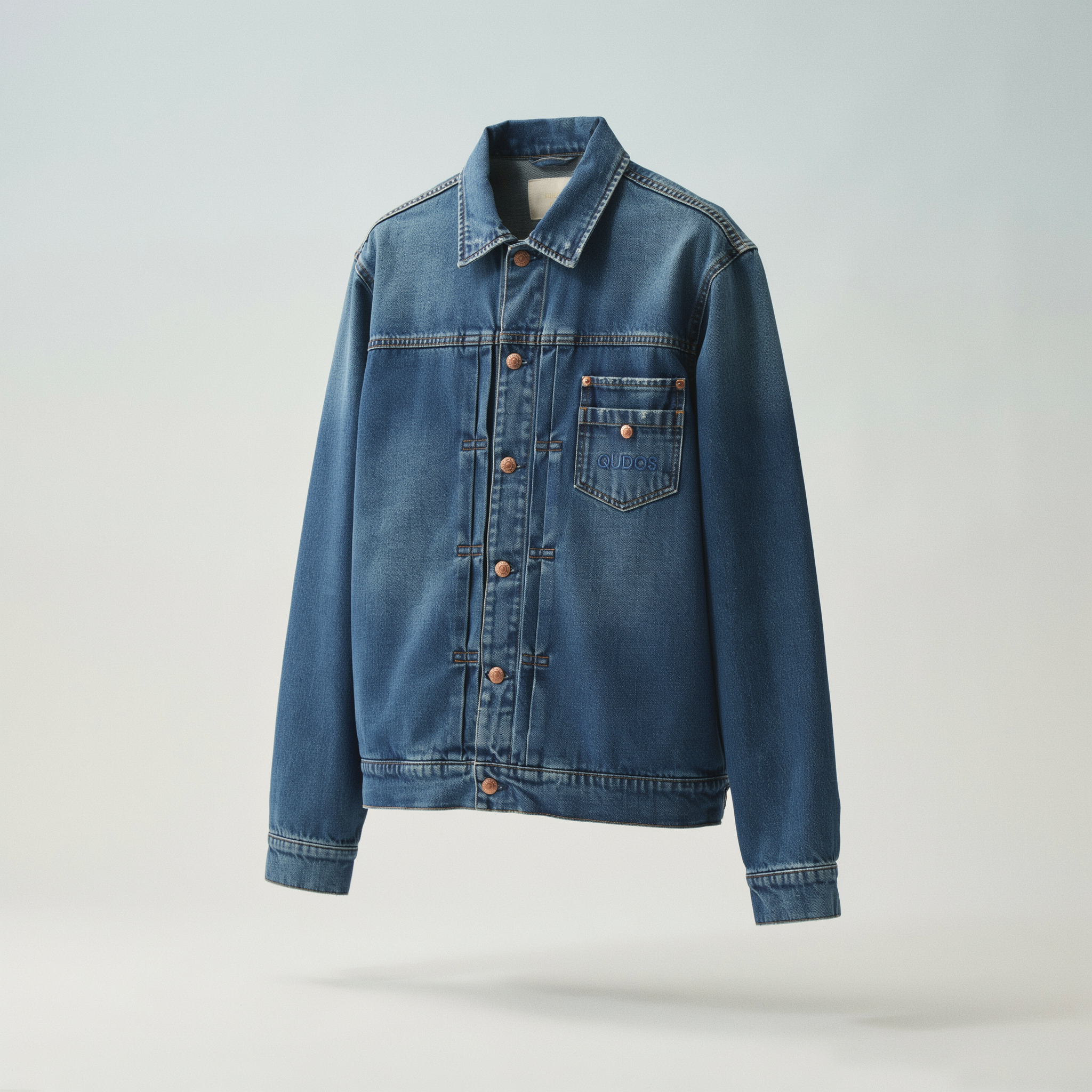 Qudos blue jacket presented as an editorial piece on outerwear silhouette and color theory